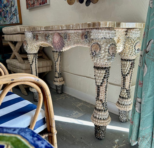 shell encrusted console table