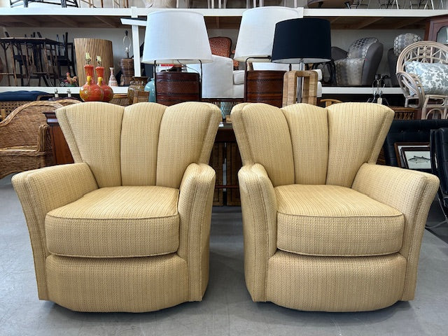pair scalloped swivel chairs